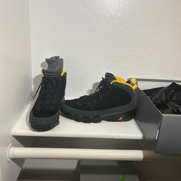black and yellow jordans retro 9